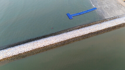 Aerial view of Beautiful rock breakwater in Thailand.