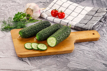 Raw green cucumbers with slices