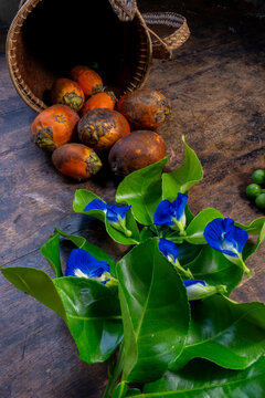 areca nuts, kaffir lime leaves with eatable blue flowers