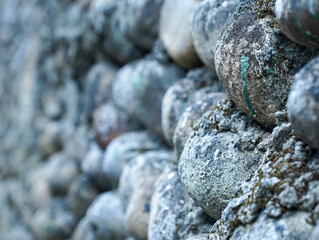 a wall made of round stone
