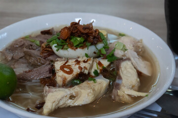 close up of a chicken and beef soto. Indonesian food