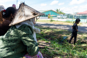 person in a hat taking a break at countryside