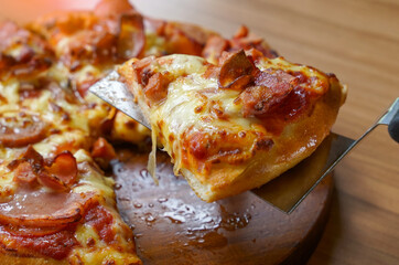 Pizza is an Italian fast food consisting of a flat round dough topped with tomato sauce. Then cooked by baking in the oven, there are many toppings to choose from.