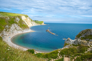 Man O'War Beach next to Durdle Door on Jurassic Coast, Dorset, England, UK. Scenic bay surrounded by Jurassic Coast rocks. Sunny summer days. beautiful landscape and seascape view. English Channel sea