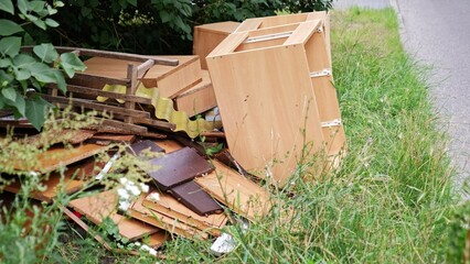 Old Furniture Disposed by New House Owner During Renovation Prepared for Curbside Garbage Pickup by...