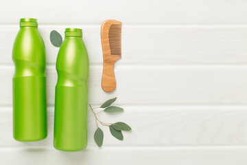 Professional herbal hair care on wooden background, top view