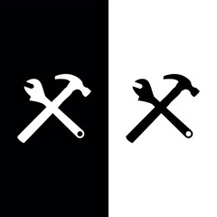 It's a crossed hammer and wrench solid icon. Repair tools and worker equipment symbol on a white background