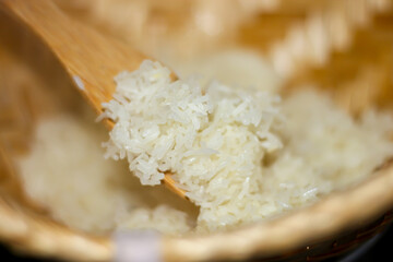 Sticky rice on bamboo tray with closeup style.