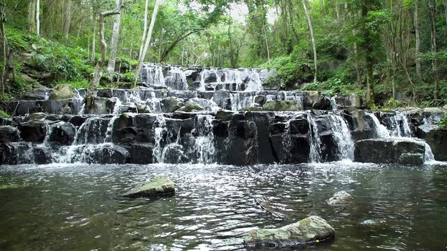 Beautiful waterfall in tropical forest at Namtok Samlan National Park, Saraburi, Thailand - Slow Motion