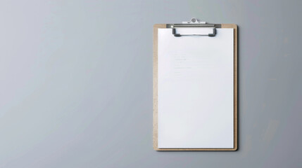 A minimalist clipboard against a stark gray background with a blank sheet of paper clipped, emphasizing simplicity and organization.