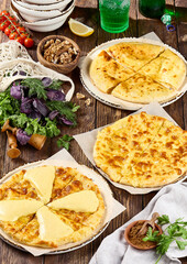 Traditional Georgian Khachapuri Assortment on Wooden Background