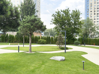 Empty green field around by business zone 