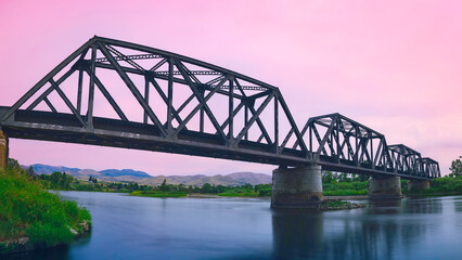 Montana Railroad Missouri River Bridge, built in 1883 in Townsend, Broadwater County, Montana: Sunset hazy landscape during the wildfire