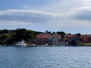 Fototapeta premium a village with a blue sky with white clouds