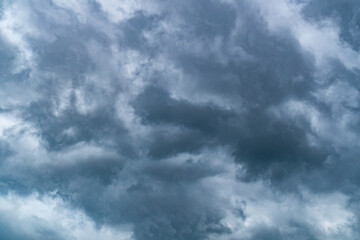 Dark rain cloudss in the sky before rain in rainy season in the rural of Thailand.