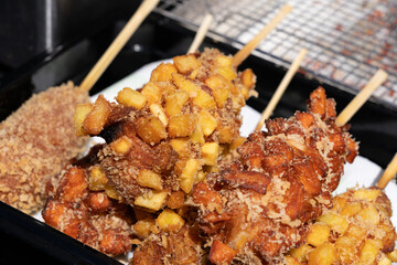 Japanese corn dog, Korean street food corndog, takoyaki, deep fried onion potato and meat