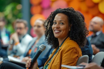 Young businesswoman with a microphone at a business conference. Public speaking concept.