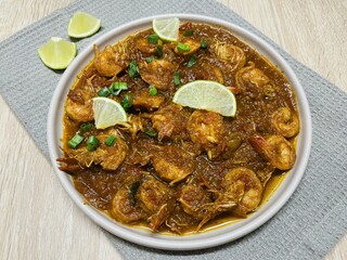 Udang bumbu balado. Shrimp with spicy chili sauce. Traditional cuisine from West Sumatra, Indonesia. Perfect for recipe, article, catalogue, or any cooking contents.