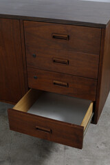 Oiled Walnut Credenza. Stylish mid-century modern furniture. Close-up photograph.