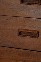 Oiled Walnut Credenza. Stylish mid-century modern furniture. Close-up photograph.