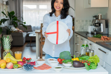 Indian Nutritionist explaining healthy balanced plate according to proportions of nutrients in...