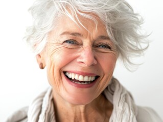 radiant senior woman laughing closeup portrait showcasing genuine joy and perfect teeth bright white background