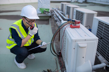 Refrigeration and Air Conditioning Engineering Detects Plant Cooling Problems,electrician maintenance Condensing on the rooftop outdoors of large industrial building