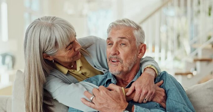 Mature couple, hug and watching tv on sofa with happy marriage, support and talking of pension at home. Man and woman smile on couch for comfort film, movie or show with memory, bonding and break