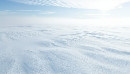 Showcasing the serene expanse of white snow from an aerial perspective on a sunny winter day