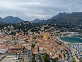 Fototapeta premium Aerial view on French Riviera, colorful Menton old city and marina on Mediterranean Sea near French-Italian border, travel destination, panoramic view from above
