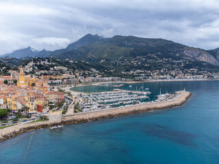 Aerial view on French Riviera, colorful Menton old city and marina on Mediterranean Sea near French-Italian border, travel destination, panoramic view from above