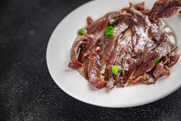 anchovies in a plate on the table canned fish in oil fresh and tasty seafood meal food snack on the table copy space food background rustic