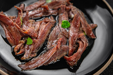anchovies in a plate on the table canned fish in oil fresh and tasty seafood meal food snack on the table copy space food background rustic