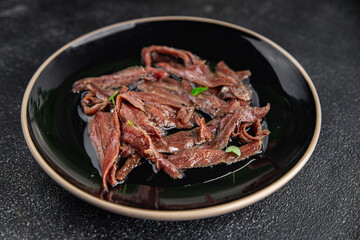 anchovies in a plate on the table canned fish in oil fresh and tasty seafood meal food snack on the table copy space food background rustic