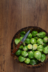 fresh Brussels sprouts, raw, top view, on a wooden table, no people,