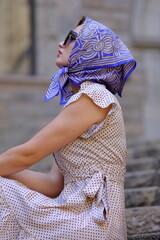 Beautiful woman with blue eyes dressed in the 1920s in the Barcelona cathedral