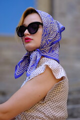 Beautiful woman with blue eyes dressed in the 1920s in the Barcelona cathedral