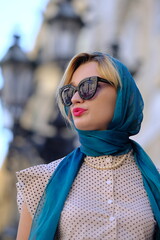 Beautiful woman with blue eyes dressed in the 1920s in the Barcelona cathedral