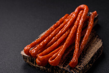 Mini sausages or cabanosi smoked with salt and spices