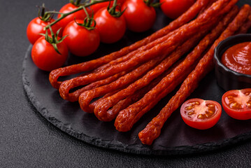 Mini sausages or cabanosi smoked with salt and spices