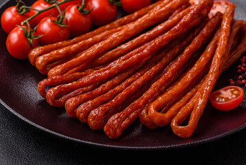 Mini sausages or cabanosi smoked with salt and spices