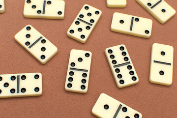 Dominoes bones on brown background