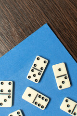 Dominoes bones on blue background