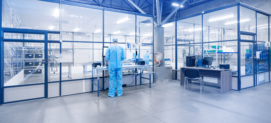 Worker on workplace to sterile box for production of medical equipment made of non woven material...