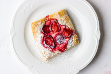 Puffs with strawberries and strawberries. The process of making summer dessert