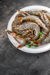 shrimp raw seafood prawns natural food fresh appetizer meal food snack on the table copy space food background rustic keto or paleo diet Pescetarian