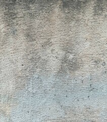 Rough gloomy wall, covered with cement (concrete). Good for backdrops (backgrounds), industrial themes, collages.