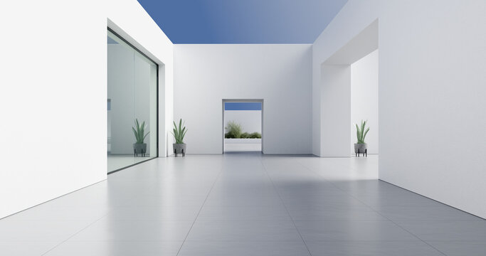 Espacio arquitect&oacute;nico moderno y minimalista con luz natural. &Aacute;rea abierta y limpia con paredes blancas, suelo de grandes baldosas grises y plantas en macetas. 