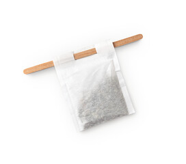 tea bag with wooden stick stirrer with shadow isolated on transparent background
