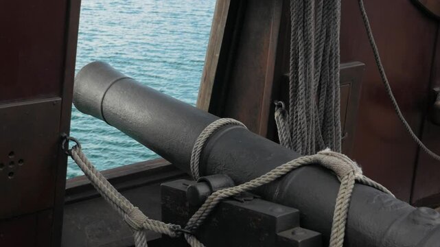 close-up shot of a historic 18th century cannon on board a Spanish sailing ship